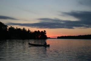 Canoe during sunset on the lake
