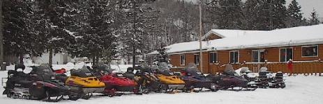 Sleds piling up in the parking lot for a rest