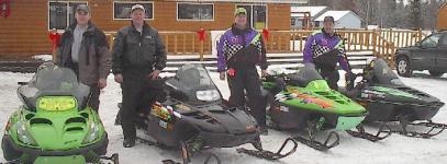 Some riders getting ready to ride